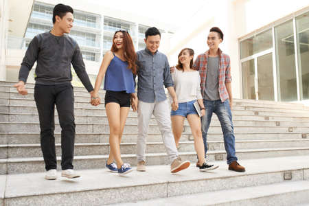 Group of teenagers walking together from schoolの写真素材