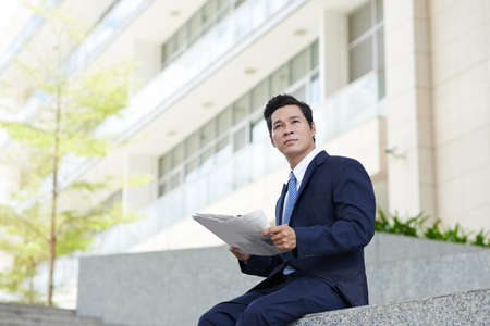 Portrait of handsome businessman looking at cameraの写真素材