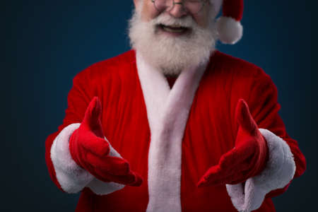 Cropped image of Santa giving you invisible presentの写真素材