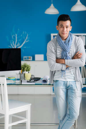 Portrait of stylish handsome businessman in his officeの写真素材