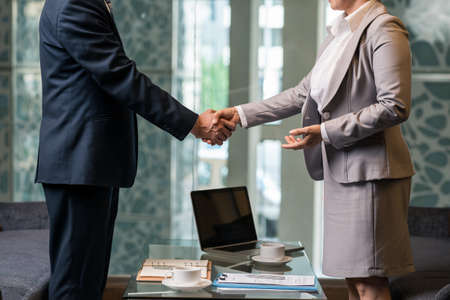 Cropped image of business people shaking hands after successful dealの写真素材