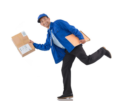 Express delivery: Asian courier running with parcel in his handの写真素材