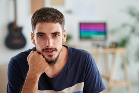 Portrait of handsome young musician in his studioの写真素材