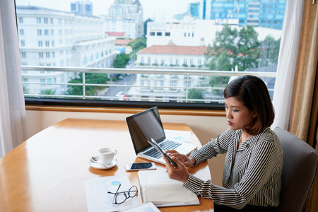 Working with tablet computerの写真素材