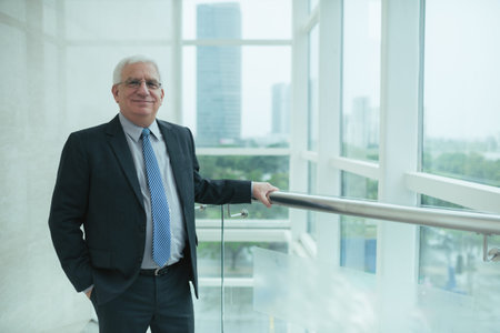 Portrait of smiling senior businessman in the modern office