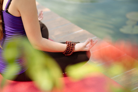 Hands of meditating woman: yoga, fitness and lifestyle concept