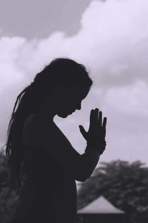 Black and white image of meditating womanの写真素材
