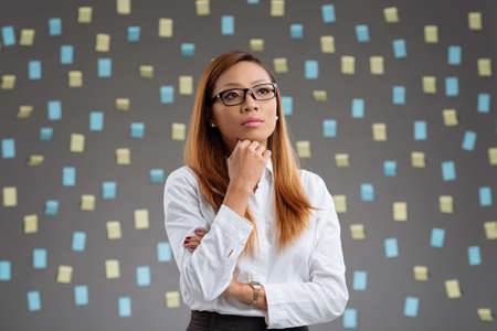 Young Vietnamese woman contemplating business ideasの写真素材