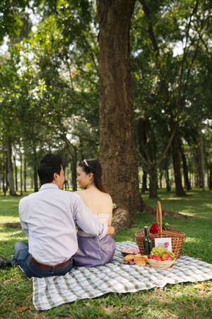 Young people dating on picnic in parkの写真素材