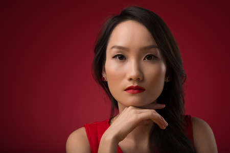 Pretty Asian girl looking at cameraの写真素材