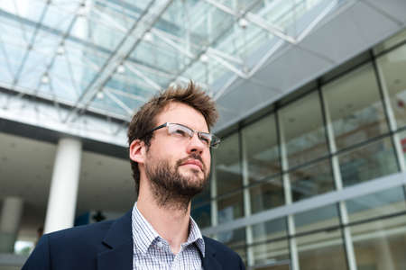 Portrait of manager in glasses looking awayの写真素材