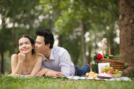 Attractive young people resting together on picnicの写真素材