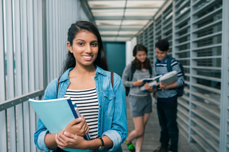 Portrait of a teenage girl in school buildingの写真素材