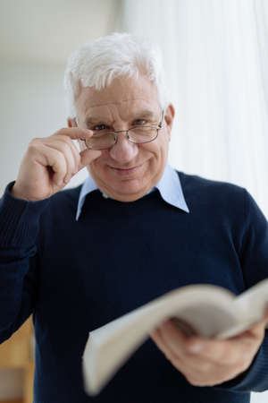 Portrait of positive senior man in glassesの写真素材