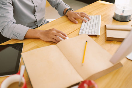 Male hands computing in the officeの写真素材