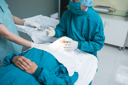 Cropped image of specialist performing operation on eye