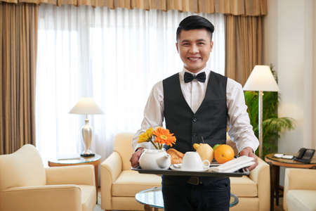 Serving breakfastの写真素材