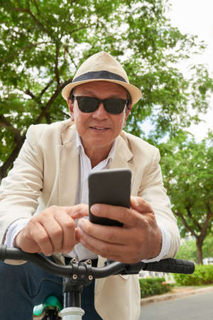Checking smartphoneの写真素材