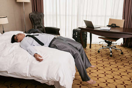 Sleeping businessmanの写真素材