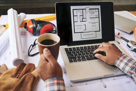 Close-up image of engineer working on apartment projectの写真素材