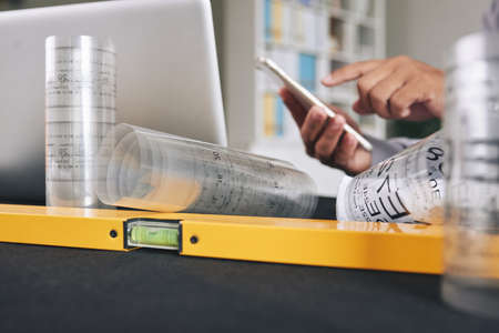 Close-up image of construction level on table of architectの写真素材