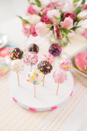 Different cake pops on the stand, selective focus