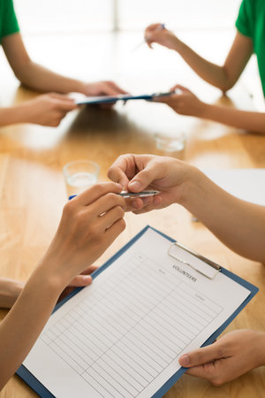 People offering to sign up to volunteerの写真素材