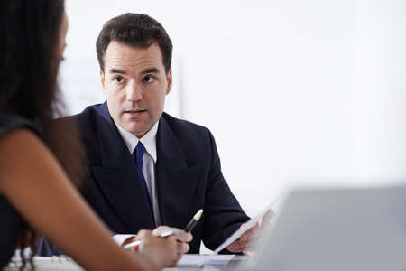Businessman having meeting with his female colleagueの写真素材