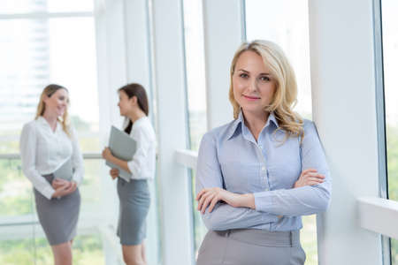 Portrait of smiling confident female entrepreneurの写真素材