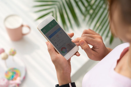 Girl using application on her smartphone to check healthの写真素材