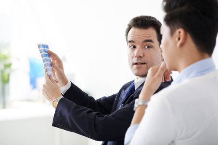 Designer and client choosing color for icon designの写真素材