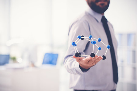 Investor holding molecular structure modelの写真素材
