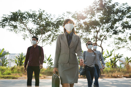 Vietnamese people going to work in mouth masks