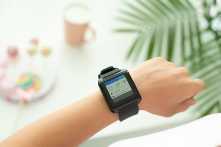 Woman checking health indications in her smart watch
