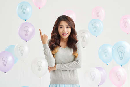 Beautiful Asian girl having ideaの写真素材