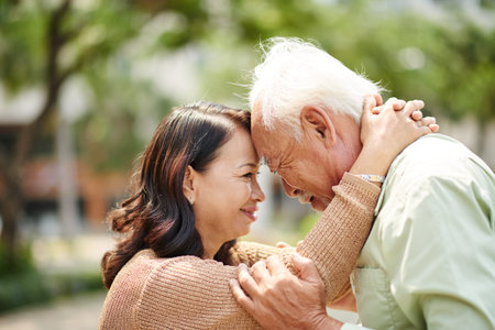 Happy senior people smiling when looking at each other