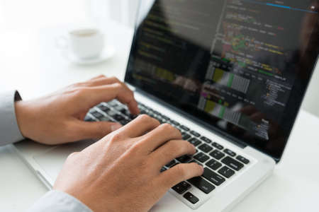 Hands of coder working on new applicationの写真素材
