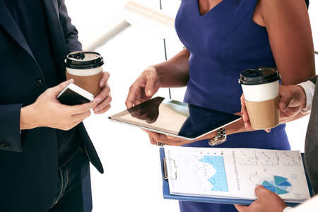 Close-up image of business people discussing market situationの写真素材