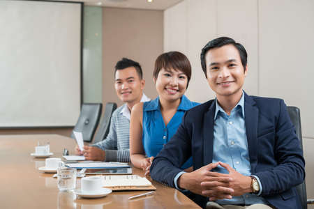 Portrait of Asian business colleagues in meeting roomの写真素材