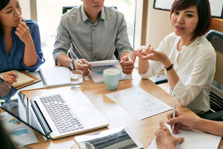 Business team discussing financial reports at the meetingの写真素材
