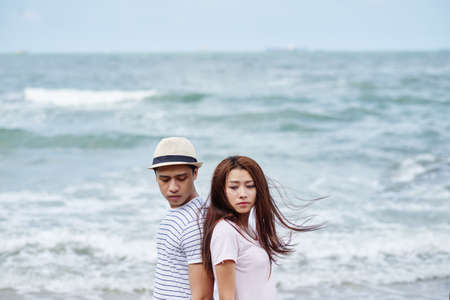 Vietnamese young couple having difficulties in relationshipの写真素材