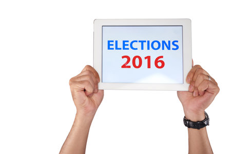 Hands holding tablet with elections 2016 inscription