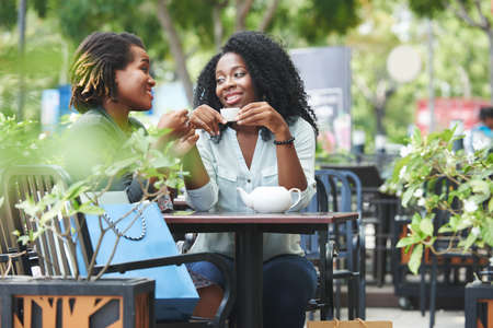 Enjoying tea and talk with friendの写真素材