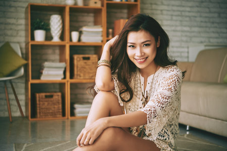 Portrait of charming Vietnamese girl at homeの写真素材