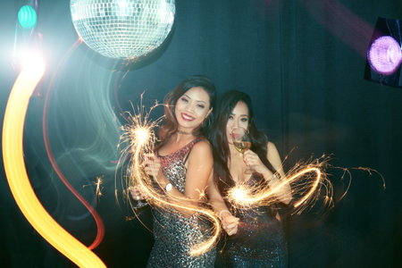 Joyful pretty women enjoying party in the club