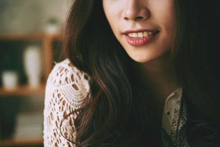 Cropped image of young woman with beautiful smileの写真素材