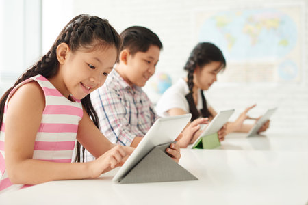 Excited girl using application on tablet computerの写真素材