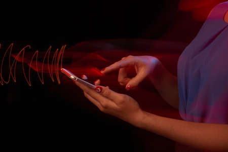 Close-up image of female hands using smartphoneの写真素材