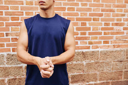 Cropped image of male athlete working out outdoorsの写真素材