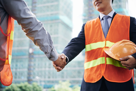 Cropped image of investor and contractor shaking handsの写真素材